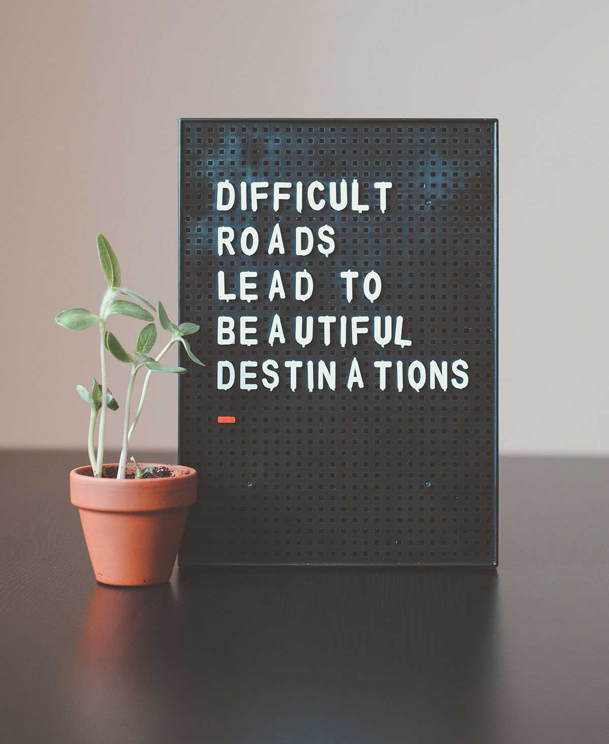 Photo that says Difficult Roads Lead to Beautiful Destinations
